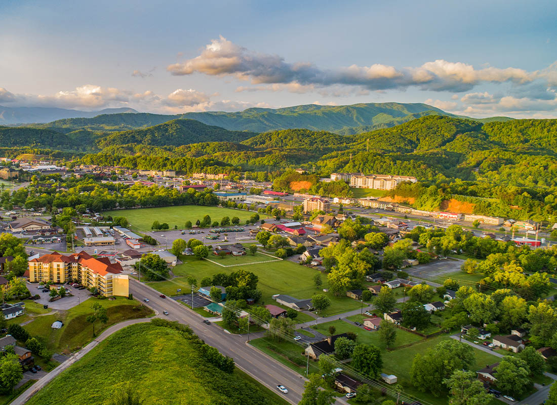 Johnson City, TN - Aerial View of Tennessee Town and Mountains at Sunset